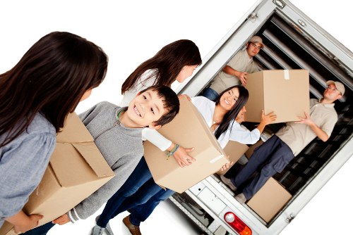 Packed boxes and furniture ready for a West Kensington apartment removal
