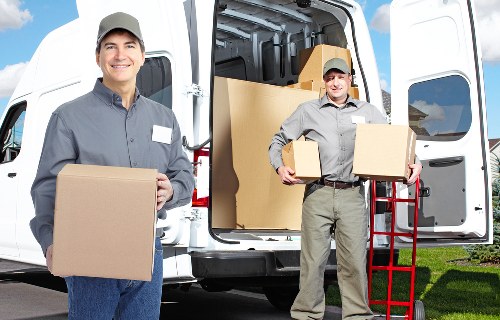Packing boxes and preparing for a man and van collection in West Kensington