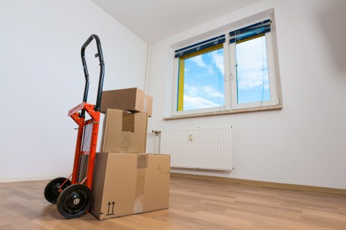 Professional movers handling household items during a local relocation